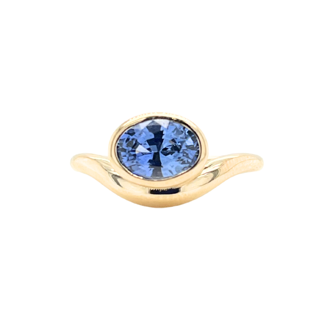 Blue Oval Sapphire Nestled Ring