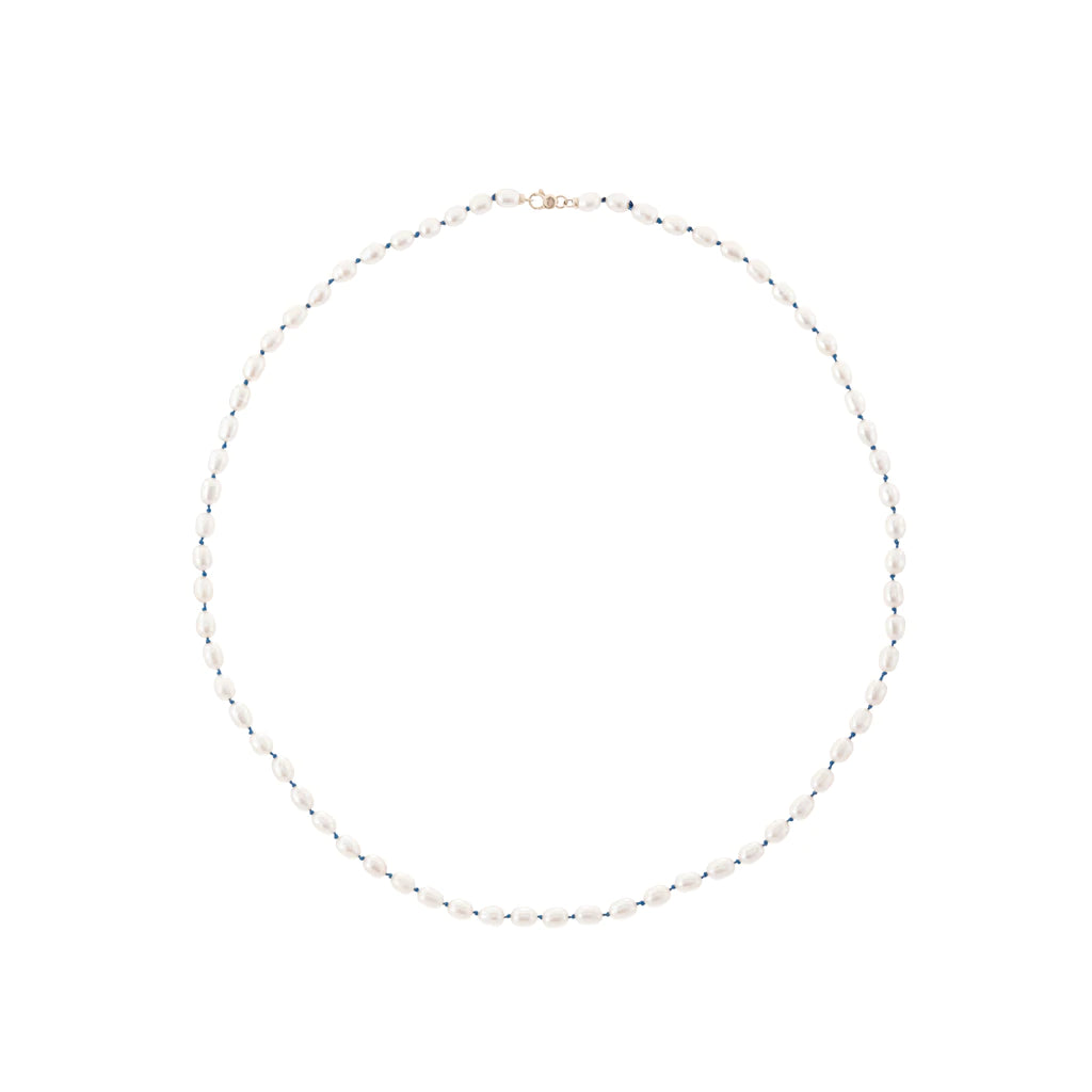 Rice pearls strung on blue sick cord.