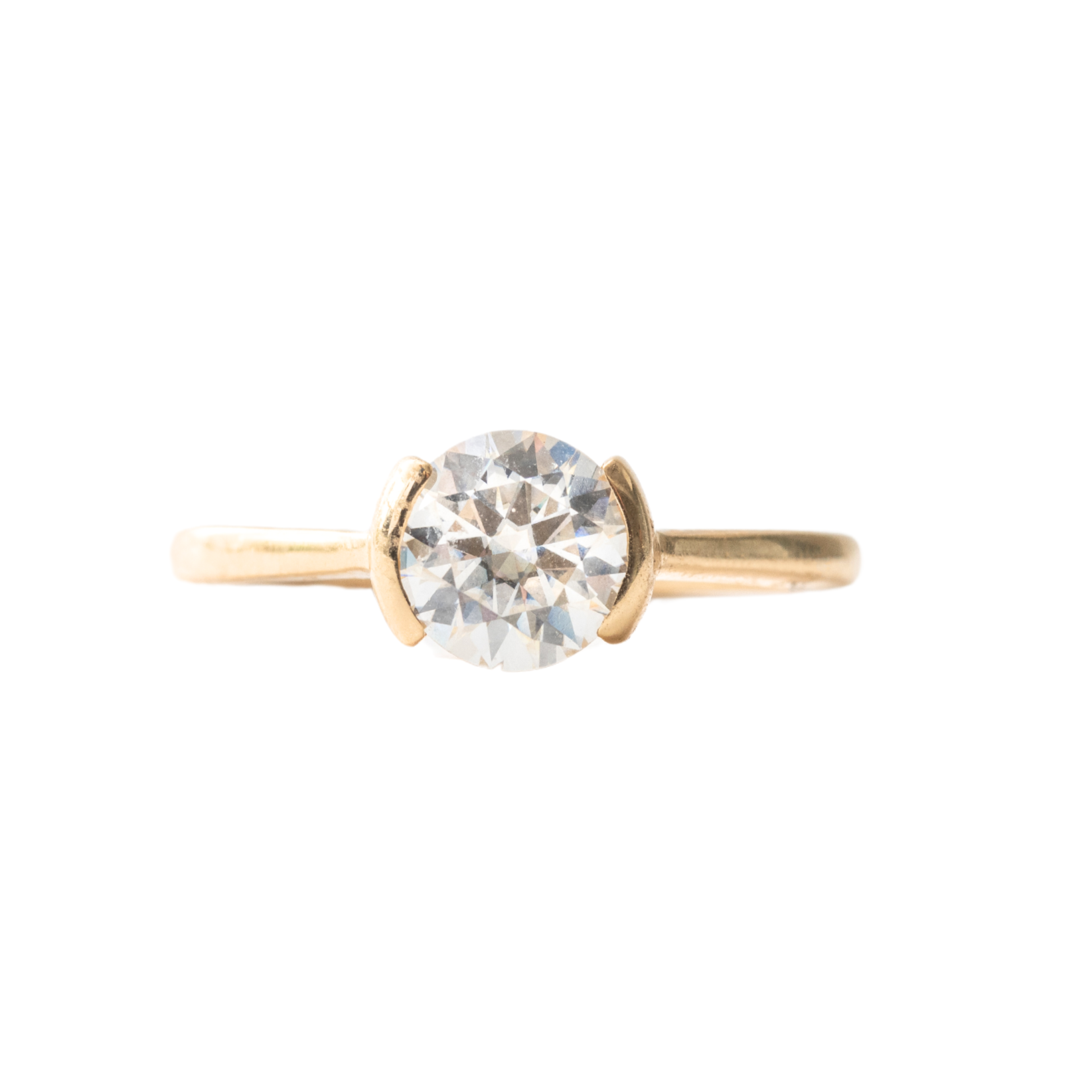 A half bezel ring design featuring a 1 carat diamond 